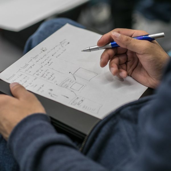 A man writing something